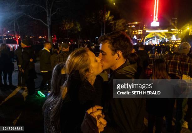 Couple kisses during "Nashville's Big Bash" to celebrate the new year, at Bicentennial Capitol Mall in Nashville, Tennessee, on January 1, 2023.