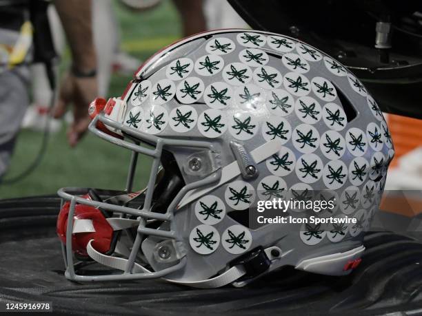 An Ohio State football helmet sits on the sideline during the Chick-fil-A Peach Bowl College Football Playoff Semifinal game between the Georgia...