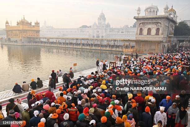 Devotees crowd to visit the Golden Temple on the occasion of New Year's Day in Amritsar on January 1, 2023.