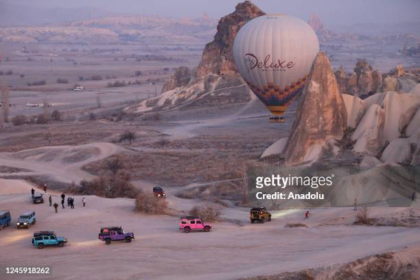 Tourists take part in hot air balloon rides on the first day of the New Year in Cappadocia of Nevsehir, Turkiye on January 1, 2023.