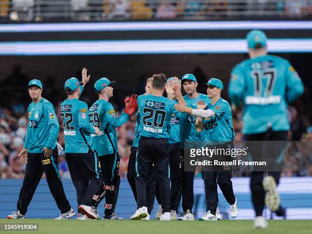 Michael Neser of the Heat celebrates the wicket of Ben Dwarshuis of the Strikers during the Men's Big Bash League match between the Brisbane Heat and...
