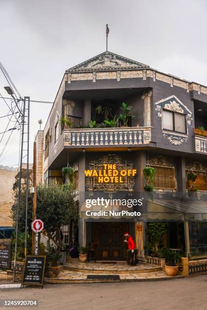 View of Banksy's 'The Walled Off Hotel' next to the Israeli separation West Bank Wall in Bethlehem, Palestine on December 28, 2022.