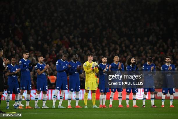 Chelsea players observe a minute's applause to honour Brazilian football legend Pele, who died on December 29, ahead of the English Premier League...