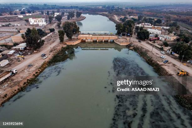 This picture taken on January 1, 2023 shows an aerial view of the Badaa water reservoir supplied by the Tigris river in the Shatra district of Iraq's...