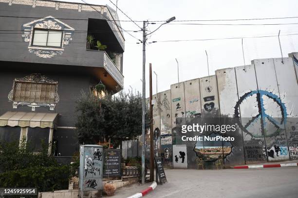 View of 'The Walled Off Hotel' and the Israeli West Bank Barrier in Bethlehem, Palestinian Territories on December 28, 2022.