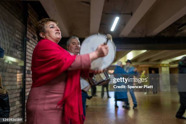 Musicians play as elderly couples participate in an ongoing traditional dance gathering in an underground mall on January 01, 2023 in Kyiv, Ukraine....