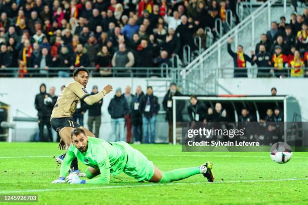 Lois Openda of RC Lens shoots to score his side's 2nd goal during the Ligue 1 match between RC Lens and Paris Saint-Germain at Stade Bollaert-Delelis...