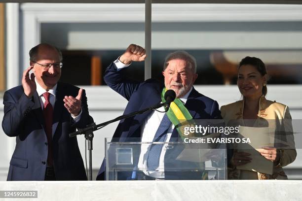 Brazil's new President Luiz Inacio Lula da Silva delivers a speech flanked by his wife First Lady Rosangela "Janja" da Silva and new Vice-President...