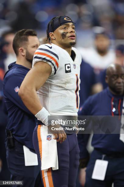 Chicago Bears quarterback Justin Fields follows the play during the second half of an NFL football game against the Detroit Lions in Detroit,...