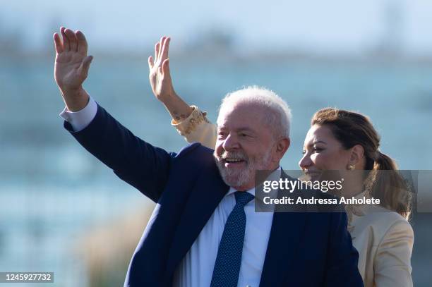 President-elect of Brazil Luiz Inacio Lula da Silva waves to supporters along his wife Rosangela da Silva as they head towards the National Congress...