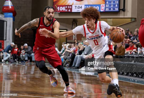 January 1: Jason Preston of the Ontario Clippers drives to the basket past Mychal Mulder of the Sioux Falls Skyforce at the Sanford Pentagon on...