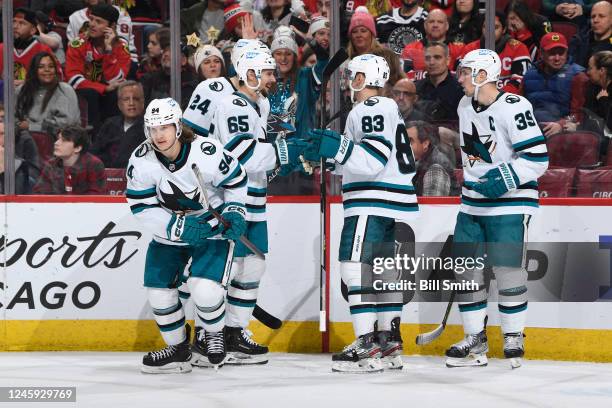 Alexander Barabanov of the San Jose Sharks skates ahead of teammates after scoring against the Chicago Blackhawks in the second period at United...