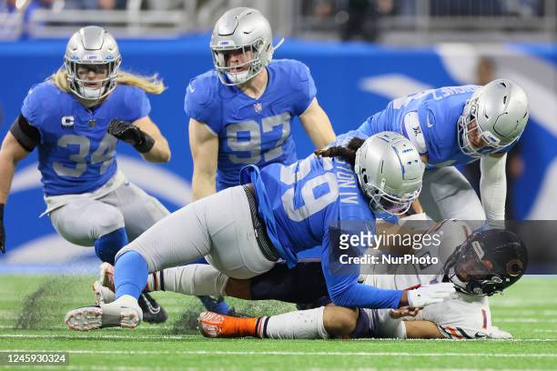 Chicago Bears quarterback Justin Fields is sacked by Detroit Lions linebacker James Houston during an NFL football game between the Detroit Lions and...