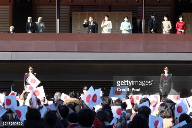 Well-wishers wave Japan's national flags as Japanese Emperor Naruhito, Empress Masako, Princess Aiko and Imperial family members are seen during the...