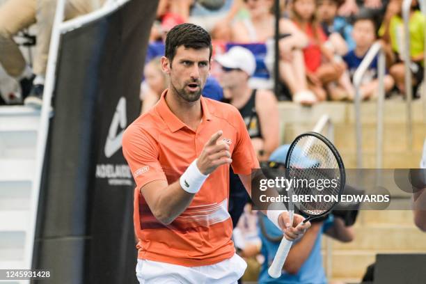 Serbian tennis player Novak Djokovic reacts during his first round doubles match with Canadian Vasek Pospisil at the ATP Adelaide International...