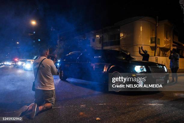 Hearse carrying the coffin of Brazilian football legend Pele arrives at Vila Belmiro stadium as fans mourn his death in Santos on January 2, 2023. -...