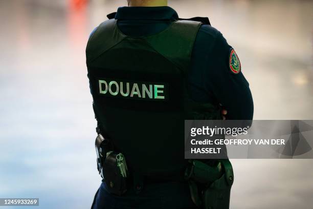 French customs officer stands at Orly Airport, south of Paris, on November 7, 2022.