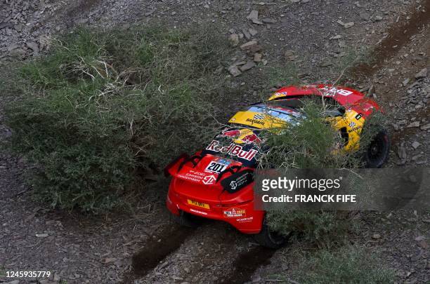 French driver Sebastien Loeb and Belgian co-driver Fabian Lurquin compete during the second stage of the Dakar 2023 rally between Sea Camp and al-Ula...