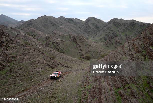 Toyota's driver Nasser al-Attiyah of Qatar and French co-driver Mathieu Baumel compete during the second stage of the Dakar 2023 rally between Sea...