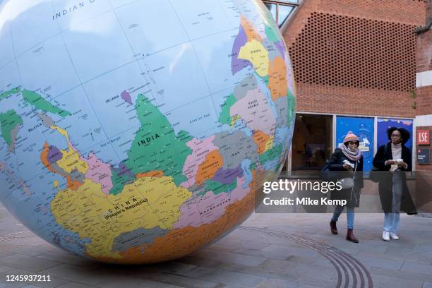 People's Republic of China and India are seen upside down on the public art sculpture The World Turned Upside Down by artist Mark Wallinger on 6th...