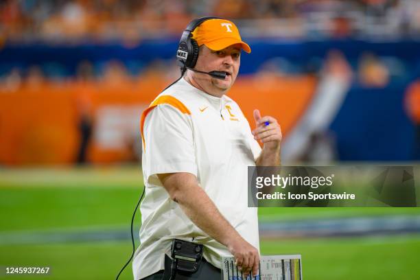 Tennessee head coach Josh Heupel talks on his headset during the Capital One Orange Bowl college football game between the Tennessee Volunteers and...