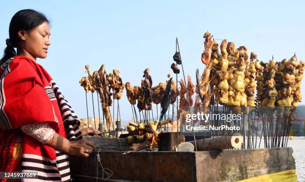 Traditional Assamese food is being prepared for sale at Brahmaputra Carnival 2023 in Guwahati , India on Jan 02, 2023 .