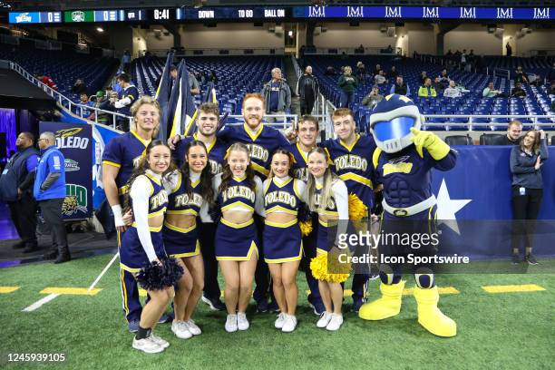 The Toledo Rockets cheerleaders pose for a group photo before the start of the Mid-American Conference college football championship game between the...