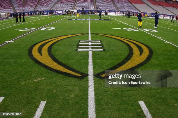 The College Football Playoff logo on the field before the VRBO Fiesta Bowl college football national championship semifinal game between the Michigan...