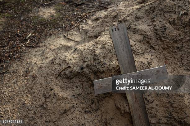 This photograph shows an empty grave after the exhumation of bodies in the mass graves dug during the Russian occupation in the city of Izium,...