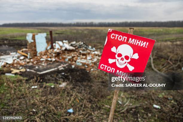 Photograph shows a warning sign which reads as "Stop Mines" written in both Ukrainian and Russian languages in the Donetsk region, eastern Ukraine,...