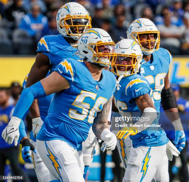 Inglewood, CA, Sunday, January 1, 2022 - Chargers defensive players celebrate after Los Angeles Chargers defensive end Morgan Fox sacked Rams...