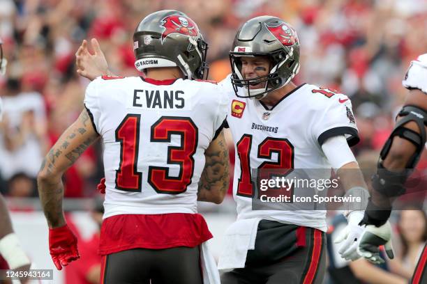 Tampa Bay Buccaneers wide receiver Mike Evans is hugged by his quarterback Tom Brady after Brady threw him a touchdown pass during the regular season...