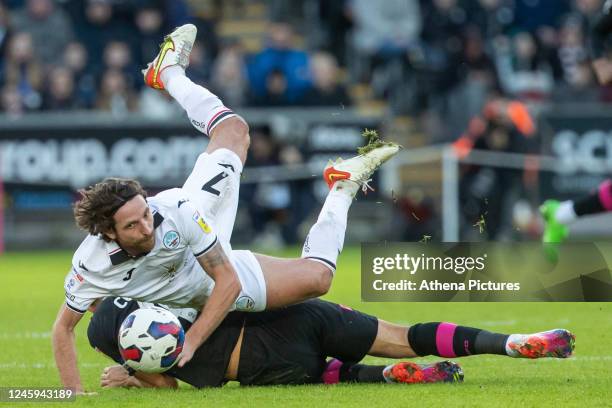 Jack Cork of Burnley tackles Joe Allen of Swansea City during the Sky Bet Championship match between Swansea City and Burnley at the Swansea.com...