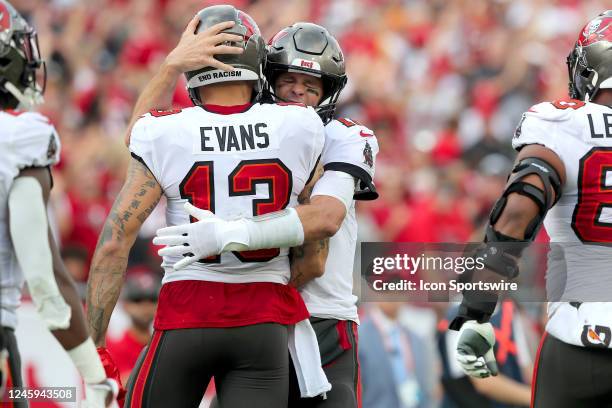 Tampa Bay Buccaneers wide receiver Mike Evans is hugged by his quarterback Tom Brady after Brady threw him a touchdown pass during the regular season...