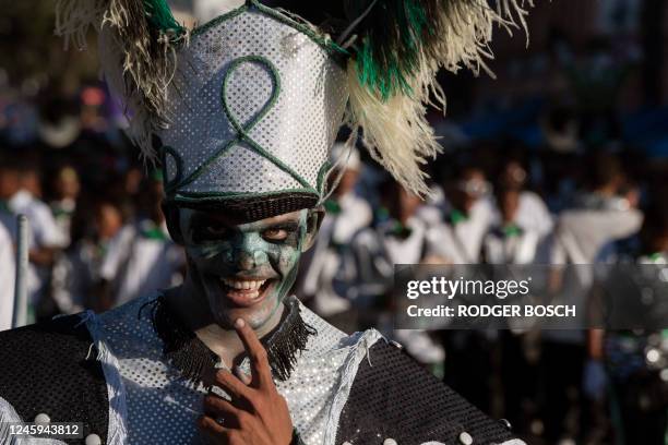 Performer gestures as he takes part in the Minstrels Parade in Cape Town on January 2, 2023. - About 20,000 performers divided into dozens of troupes...