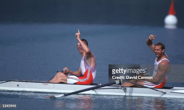 Matthew Pinsent and Stephen Redgrave of Great Britain celebrate their gold medal win in the double sculls at the Olympic Games in Barcelona....
