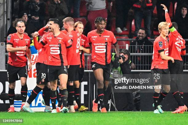 Rennes' French forward Martin Terrier celebrates with teammates after scoring the opening goal during the French L1 football match between Stade...