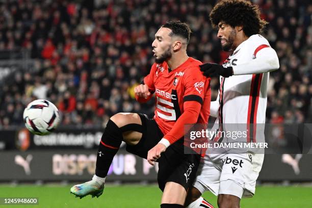 Rennes French forward Amine Gouiri fights for the ball with Nices Brazilian defender Dante during the French L1 football match between Stade Rennais...