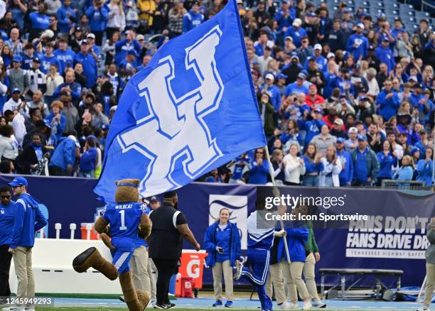 Kentucky cheerleaders lead the Wildcats onto the field before the TransPerfect Music City Bowl game between the Kentucky Wildcats and the Iowa...