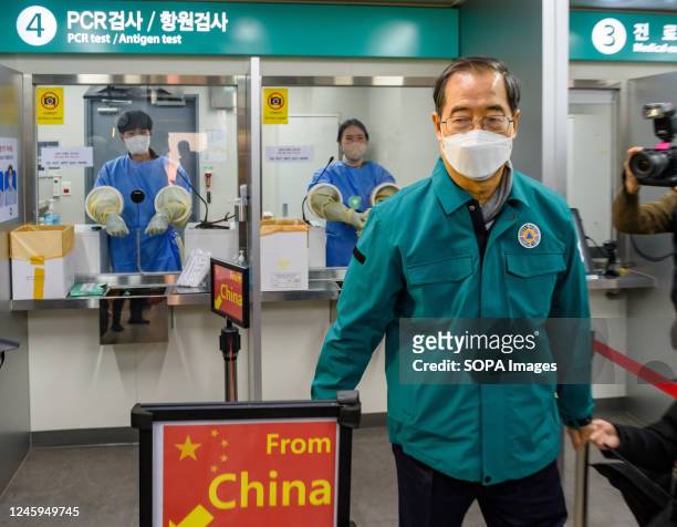 South Korean Prime Minister Han Duck-soo inspects a COVID-19 testing station at Incheon International Airport, west of Seoul. South Korea started...