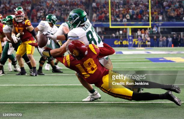 Alex Bauman of the Tulane Green Wave catches the winning touchdown pass as Eric Gentry of the USC Trojans defends in the second half of the Goodyear...