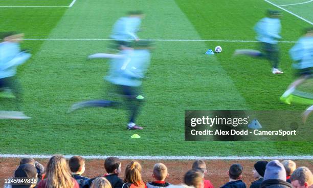 Bolton Wanderers players during the pre-match warm-up of the Sky Bet League One between Forest Green Rovers and Burton Albion at Oakwell Stadium on...