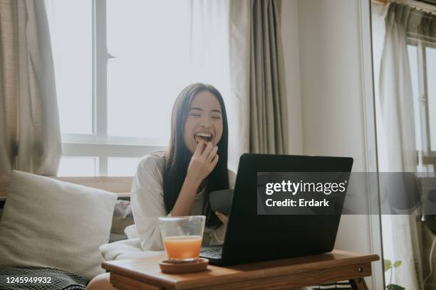 i love comedy movie - asians eating stock pictures, royalty-free photos & images