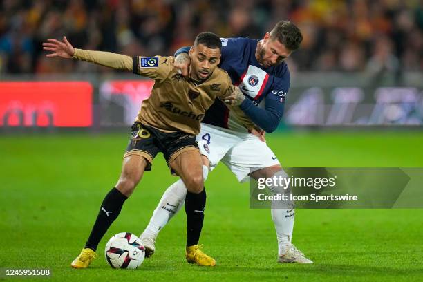 Sergio Ramos tries to stop Alexis Claude Maurice during the French Ligue 1 match between RC Lens and Paris Saint-Germain at Stade Bollaert on January...