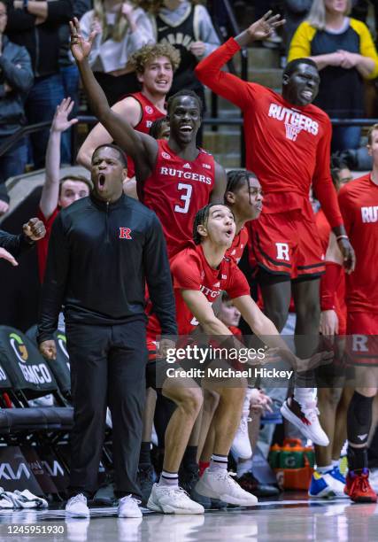 Members of the Rutgers Scarlet Knights celebrate late in the second half against the Purdue Boilermakers at Mackey Arena on January 2, 2023 in West...