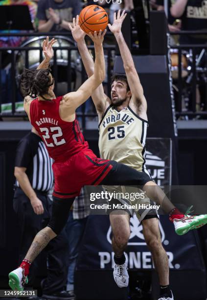 Caleb McConnell of the Rutgers Scarlet Knights goes up for a shot against Ethan Morton of the Purdue Boilermakers during the second half at Mackey...