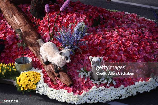 Pasadena, CA A float driver peeks his head out from underneath a large bee and between flower beds while steering the Downey Rose Float Association...