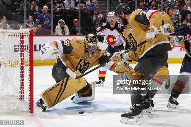 Logan Thompson of the Vegas Golden Knights eyes a loose puck in the third period against the Colorado Avalanche at Ball Arena on January 2, 2023 in...