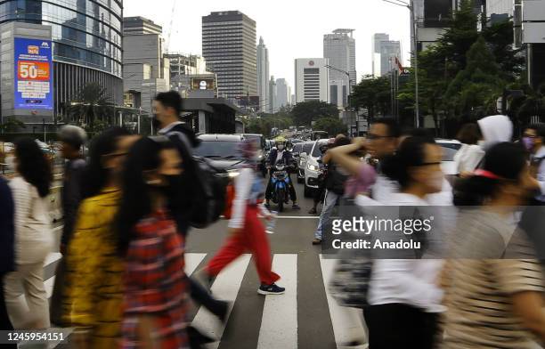 Citizens are seen crossing the street during rush hour in Jakarta, Indonesia on January 2, 2023. The Indonesian government said that this year will...