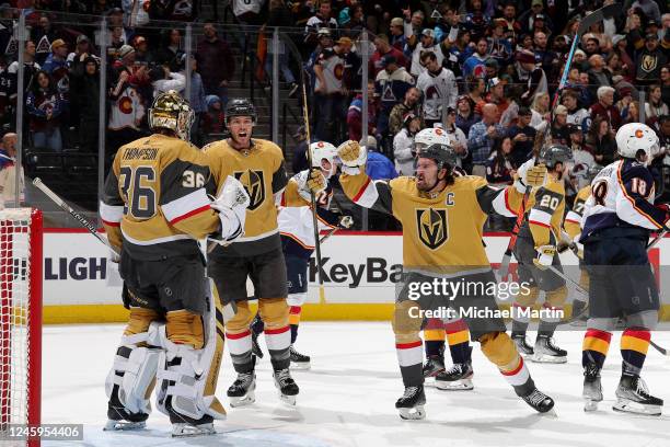 Goaltender Logan Thompson, Brayden McNabb and Mark Stone of the Vegas Golden Knights celebrate a 3-2 victory against the Colorado Avalanche at Ball...